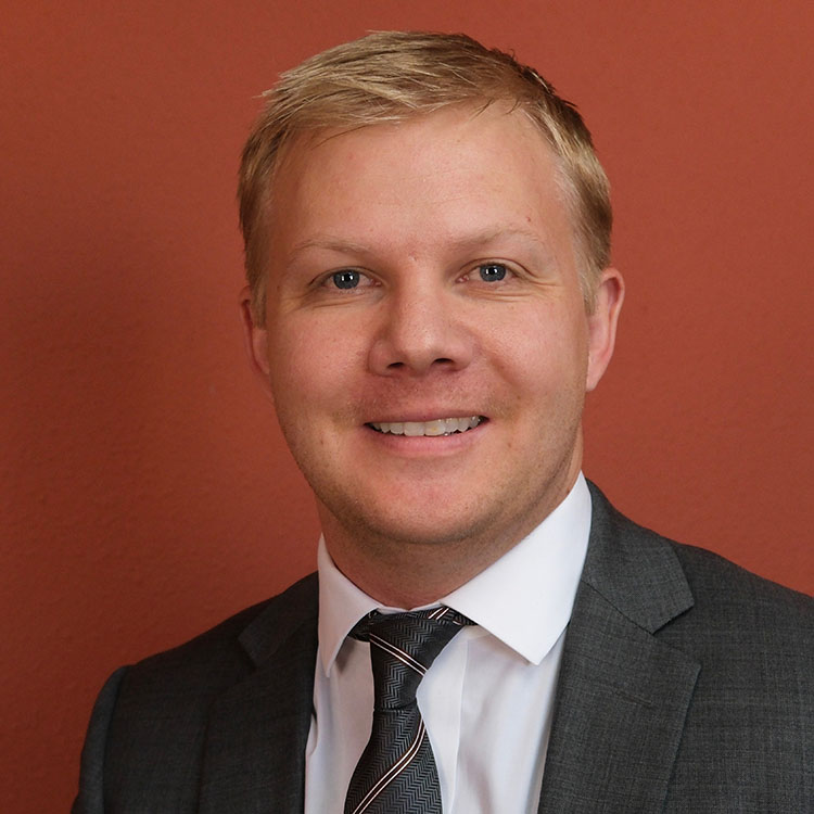 Kevin Bell, Attorney - professional head shot in law office