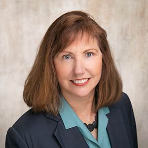 Judith Studer, Attorney - professional headshot in law office